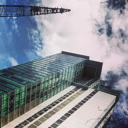 Low angle view of building against cloudy sky