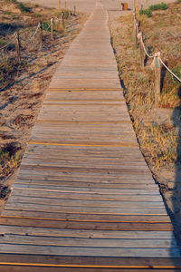 High angle view of boardwalk on footpath