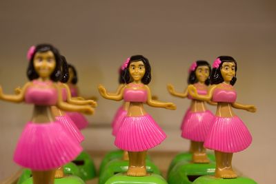 High angle view of christmas decorations over pink background