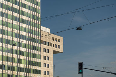 Low angle view of modern buildings against sky