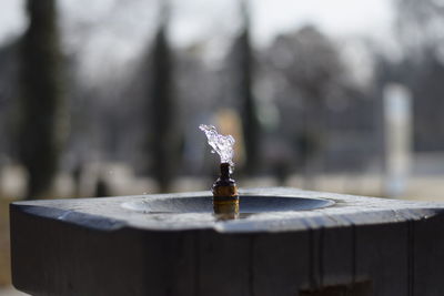 Close-up of cross on wood against temple