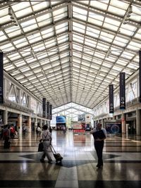 People walking on railroad station platform