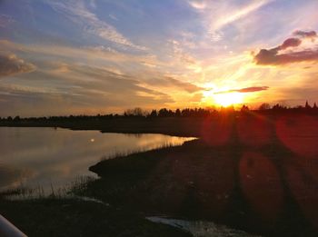 Scenic view of sunset over river