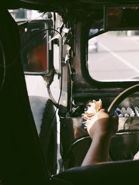 Low section of woman in car