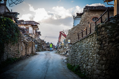 Street amidst buildings against sky