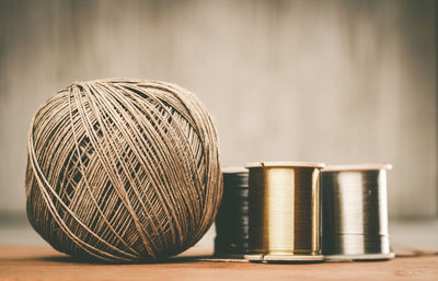 Close-up of thread spools on table