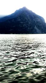 Scenic view of lake with mountains in background