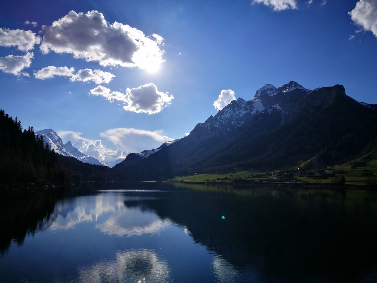 SCENIC VIEW OF LAKE AND MOUNTAINS