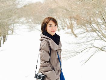 Portrait of young woman in snow