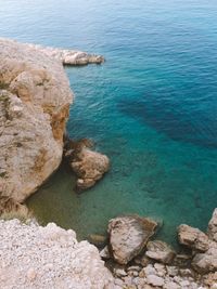 High angle view of rock formation in sea