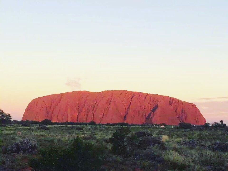 SCENIC VIEW OF ROCKS AGAINST CLEAR SKY