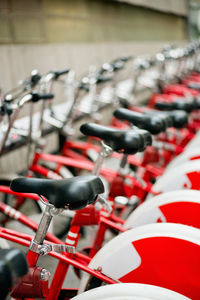 Red bicycles in row at parking lot