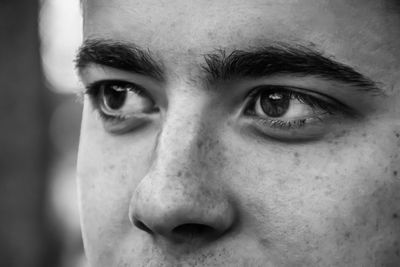 Cropped image of man looking away outdoors