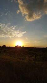 Scenic view of landscape at sunset