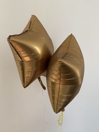 Low angle view of balloons against white background
