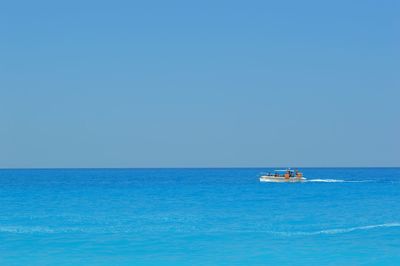 Scenic view of calm sea against clear sky