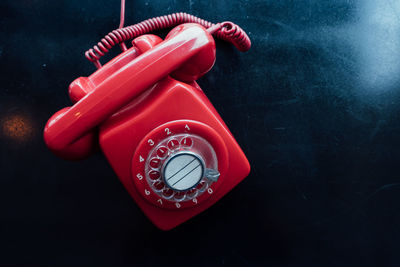 Close-up of old telephone on table