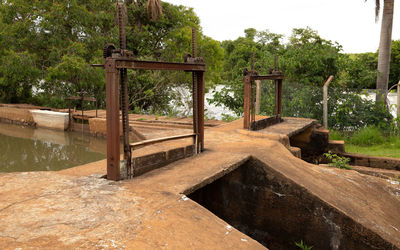 Wooden structure in park against sky