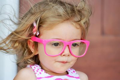 Close-up of cute girl looking away