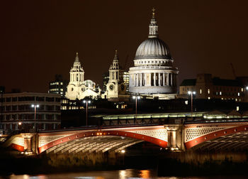 Illuminated cathedral against sky at night