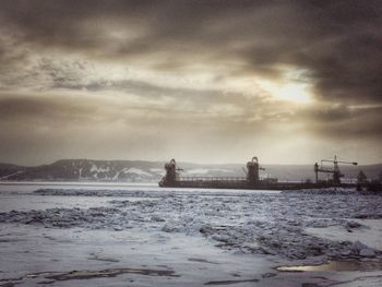 Scenic view of sea against cloudy sky
