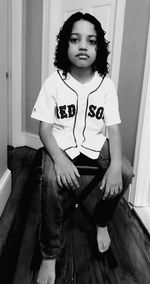 Portrait of cute girl sitting at home