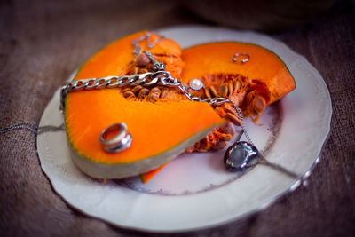 High angle view of orange slices in plate on table