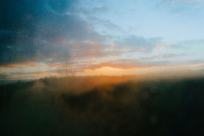 Scenic view of dramatic sky during sunset