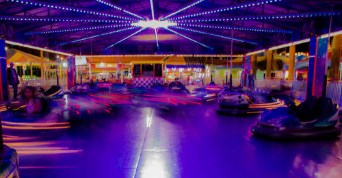 Illuminated carousel in amusement park