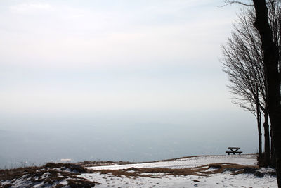 Scenic view of landscape against sky during winter