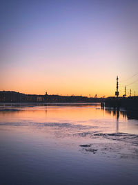 Scenic view of sea against clear sky during sunset