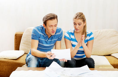 Couple discussing documents at home