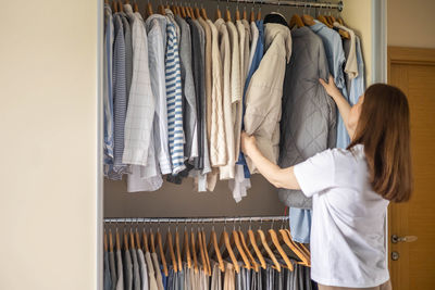 Midsection of woman standing in store