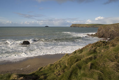 Scenic view of beach and sea against sky