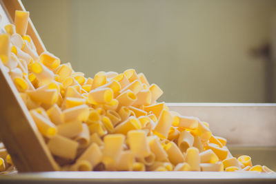 Pasta being manufactured on machinery