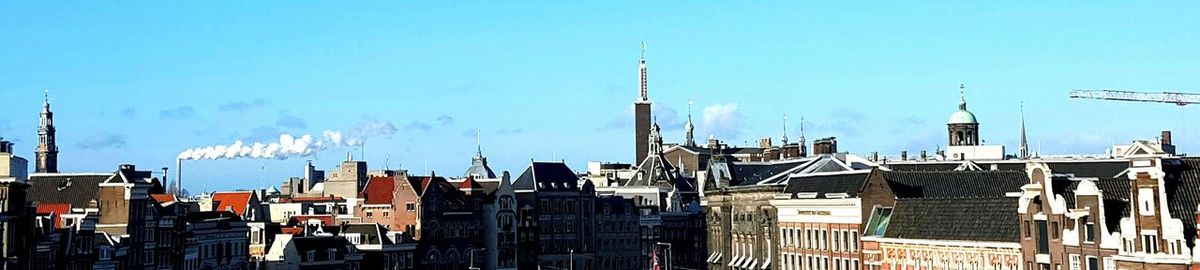 Cityscape against blue sky