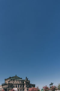 Low angle view of buildings against blue sky