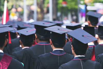 Students wearing graduation gown and mortarboard