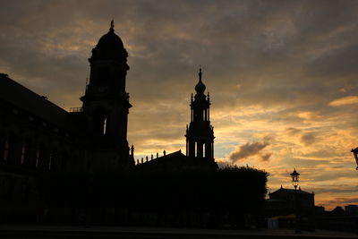 Low angle view of silhouette building against sky during sunset