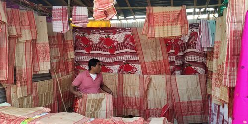 Full length of woman standing against graffiti