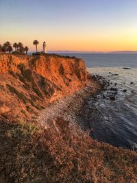 Scenic view of sea against clear sky at sunset