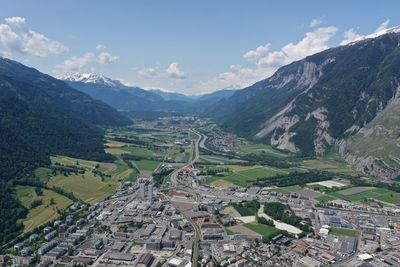 High angle view of townscape and mountains against sky