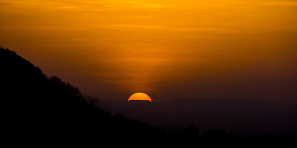 Scenic view of dramatic sky during sunset