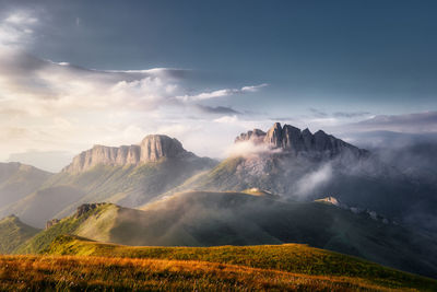 Mountain valley during bright sunrise in the fog. beautiful natural landscape. russia