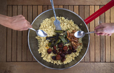 Traditional spanish cuisine. spanish migas with chorizo sausage, fried green peppers and bacon