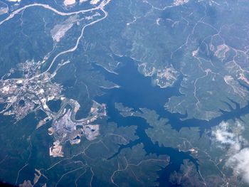 High angle aerial view of rural landscape, city and sea shore