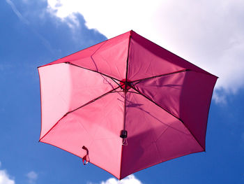 Low angle view of umbrella against sky