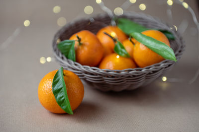 Close-up of orange fruits in basket