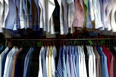 Panoramic view of clothes hanging in store