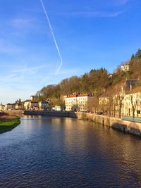 Scenic view of river against blue sky